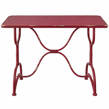 Load image into Gallery viewer, A red metal dining table with a distressed finish, featuring a rectangular top and an ornate curved X-shaped base.