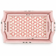 Load image into Gallery viewer, A rectangular pink serving tray with distressed edges and two side handles, featuring a geometric floral pattern in pink and cream on the inner surface, shown against a plain white background.