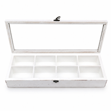 Charger l'image dans la galerie, A white wooden jewelry organizer box with a distressed finish, featuring a hinged glass lid and eight individual compartments inside, shown open on a white background.