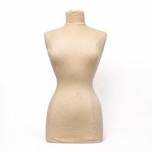 Load image into Gallery viewer, A beige fabric-covered dress form torso with a mock neck and curved waist, photographed against a plain white background.
