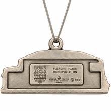 Load image into Gallery viewer, A silver-toned metal pendant necklace shaped like the state of Michigan, featuring an engraved plaque with 'Down Town Brockville' and 'Fulford Place Brockville, ON' text, suspended from a silver chain on a white background.
