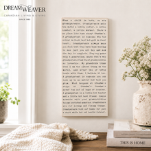 Load image into Gallery viewer, A styled interior scene with a large cream fabric-covered chair in the foreground, a matching upholstered stool at right, and a central text panel discussing grandparents. The room has warm neutral tones, soft lighting, and visible branding for Dream Weaver Canadian Living &amp; Giving in the upper left.
