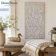 Load image into Gallery viewer, A styled interior scene with a large cream woven basket on a wooden table, next to a bookshelf with books and a framed print. A large text block overlays the center of the image, with the brand name 'DreamWeaver' visible in the top left corner.
