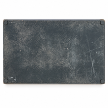 Load image into Gallery viewer, A rectangular black textured panel or plate with rounded corners and small dark feet at the corners, shown from above on a white background.
