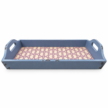 Load image into Gallery viewer, A rectangular serving tray with cutout handles, featuring a distressed blue exterior and a patterned interior with a purple trellis design on a cream background.
