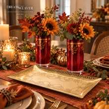 Load image into Gallery viewer, Two red glass vase centerpieces with gold trim and autumn floral arrangements, set on a decorated dining table with candles, a gold tray, plates, and fall decor. The Dream Weaver logo appears in the upper left corner.
