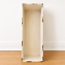 Load image into Gallery viewer, The inside of a tall, narrow rectangular Planter with a distressed cream finish and dark brown wood edges, standing on a light wood floor against a white wall.
