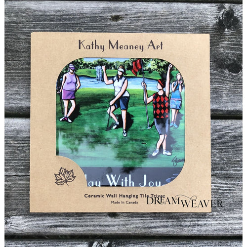 “Ceramic tile trivet featuring golfers by Canadian artist Kathy Meaney, cork-backed with gift box packaging.”
